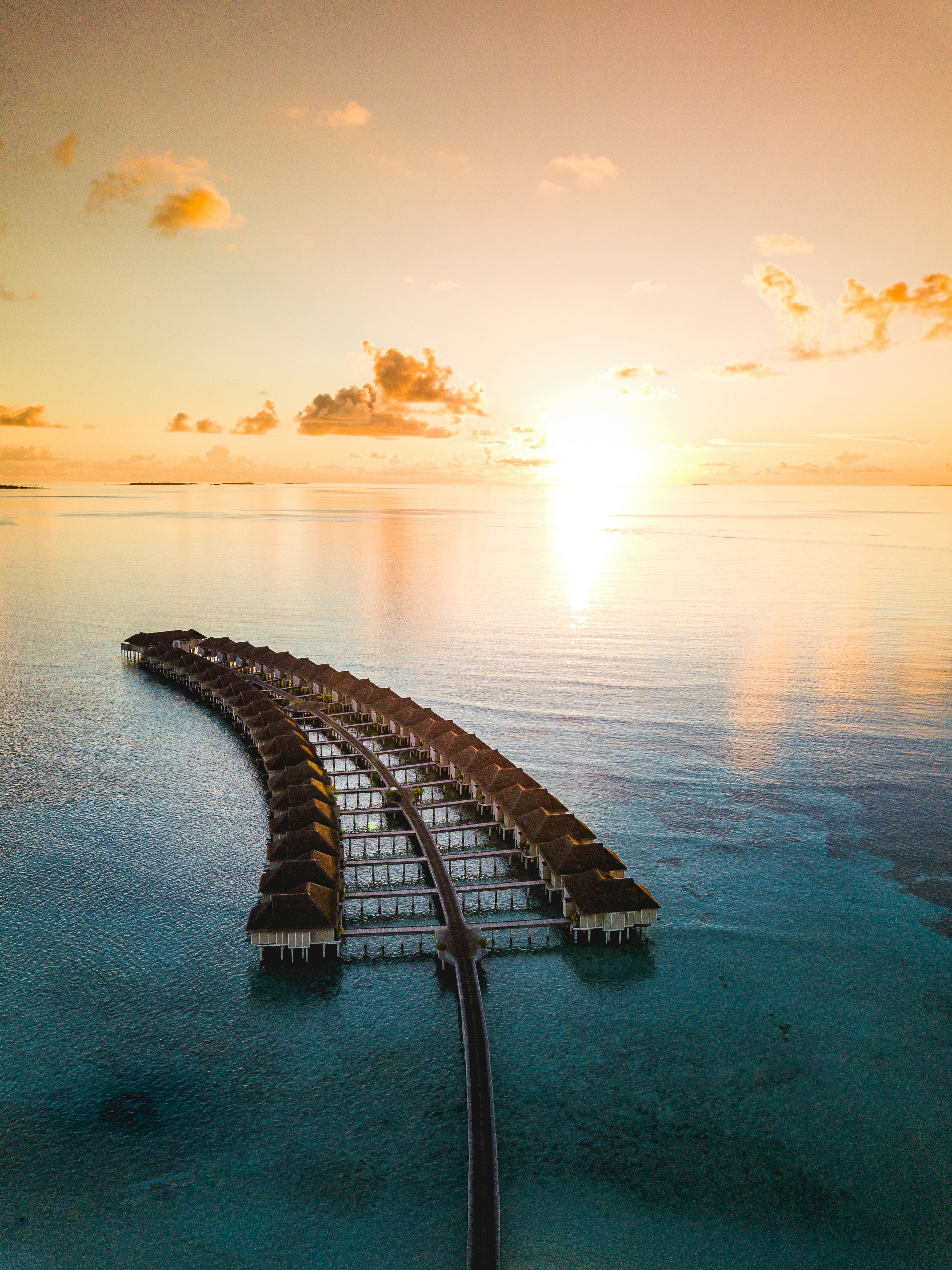 Luxury Maldives overwater villa at sunset