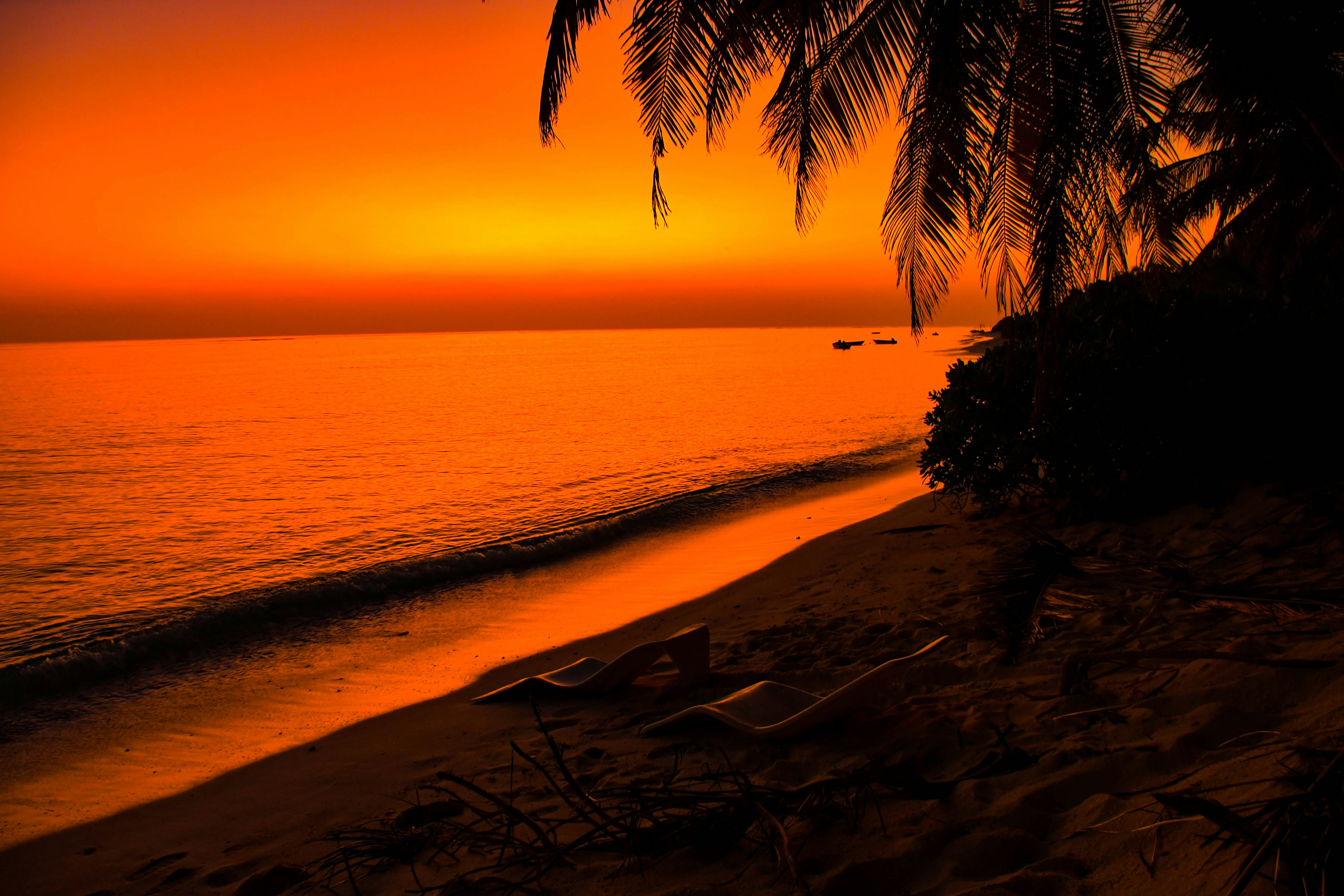 Luxury overwater villa in Maldives at sunset